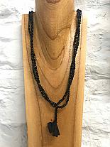 Masai America black bead necklace.976