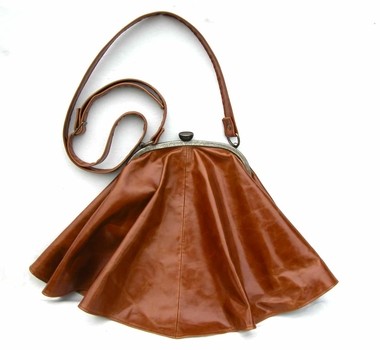 (A1) Tan skirt bag.  